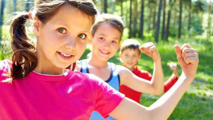 kids flexing their biceps 16 x 9