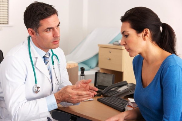 doctor talking to woman