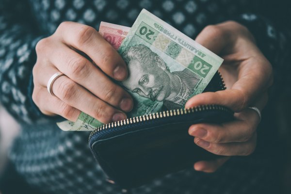 depositphotos 99980218 stock photo hands holding currency