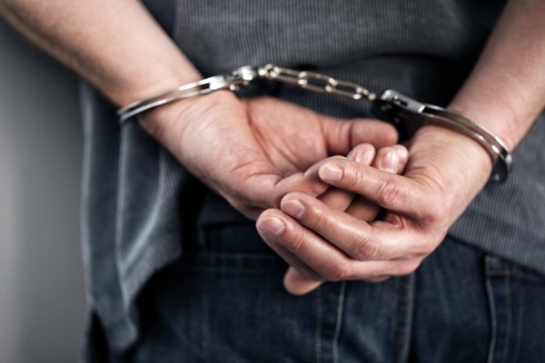 depositphotos 70908647 stock photo arrested man in handcuffs