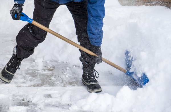 depositphotos 63938119 stock photo man removing snow with a