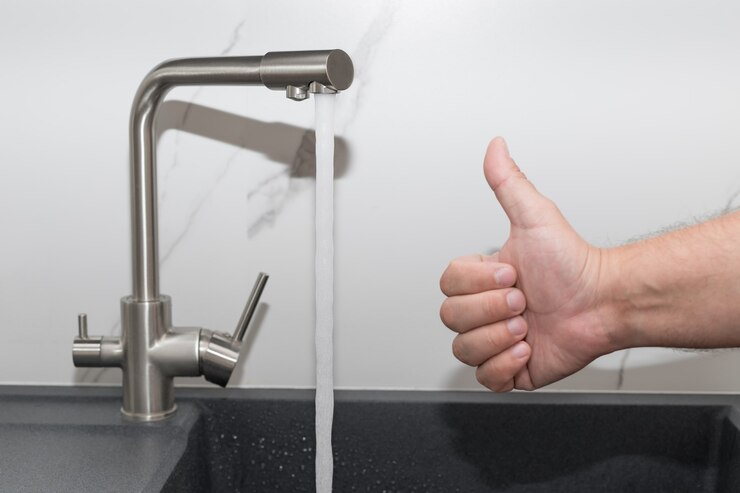 modern kitchen tap with flowing water clean water at home man showing thumbs up gesture 102556 2249